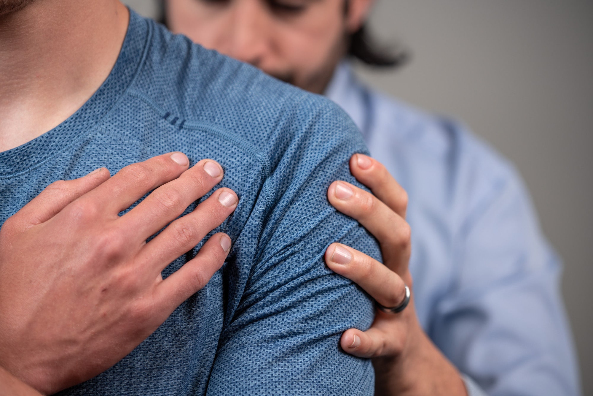 A Calgary Core Physiotherapist taking great time and attention with a client.